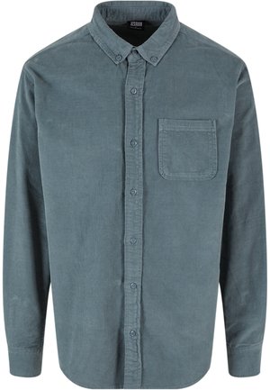 Chemise en velours côtelé bleu-gris à manches longues avec col boutonné et poche poitrine devant, fermeture à boutons sur le devant.