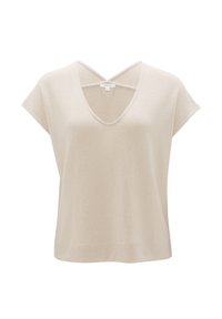 Haut en maille beige à manches courtes avec un col en V et un détail croisé au niveau de l'encolure, présenté sur fond blanc.