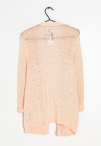 Cardigan lavorato a maglia rosa chiaro con vestibilità ampia, maniche lunghe e orlo posteriore leggermente più lungo. Realizzato in tessuto traspirante e strutturato.