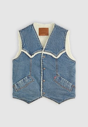 Denim vest with a shearling lining, featuring a V-shaped neckline, two front pockets, and brown leather branding label on the inside.