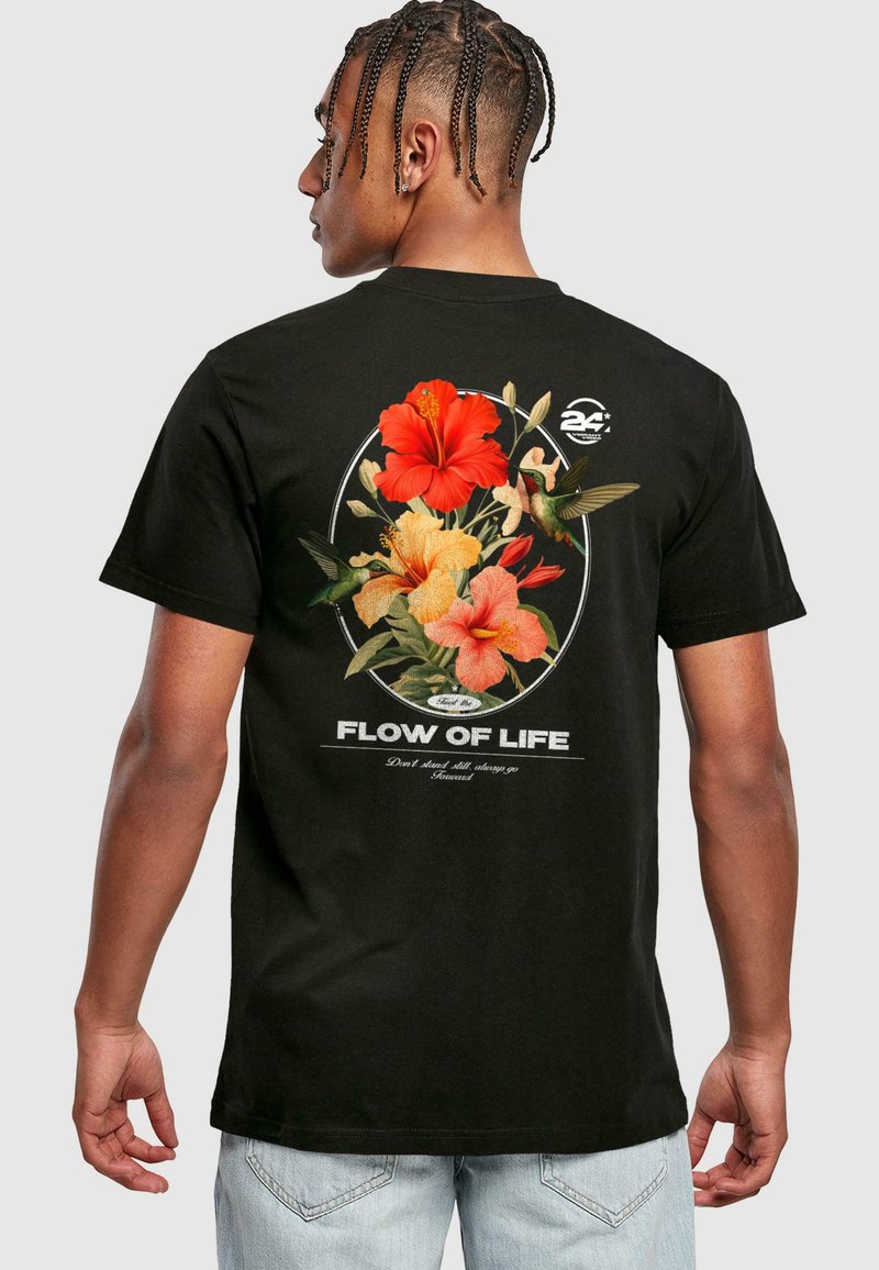 Black cotton t-shirt featuring a floral design with red and orange hibiscus, hummingbirds, and the text "FLOW OF LIFE" in white.