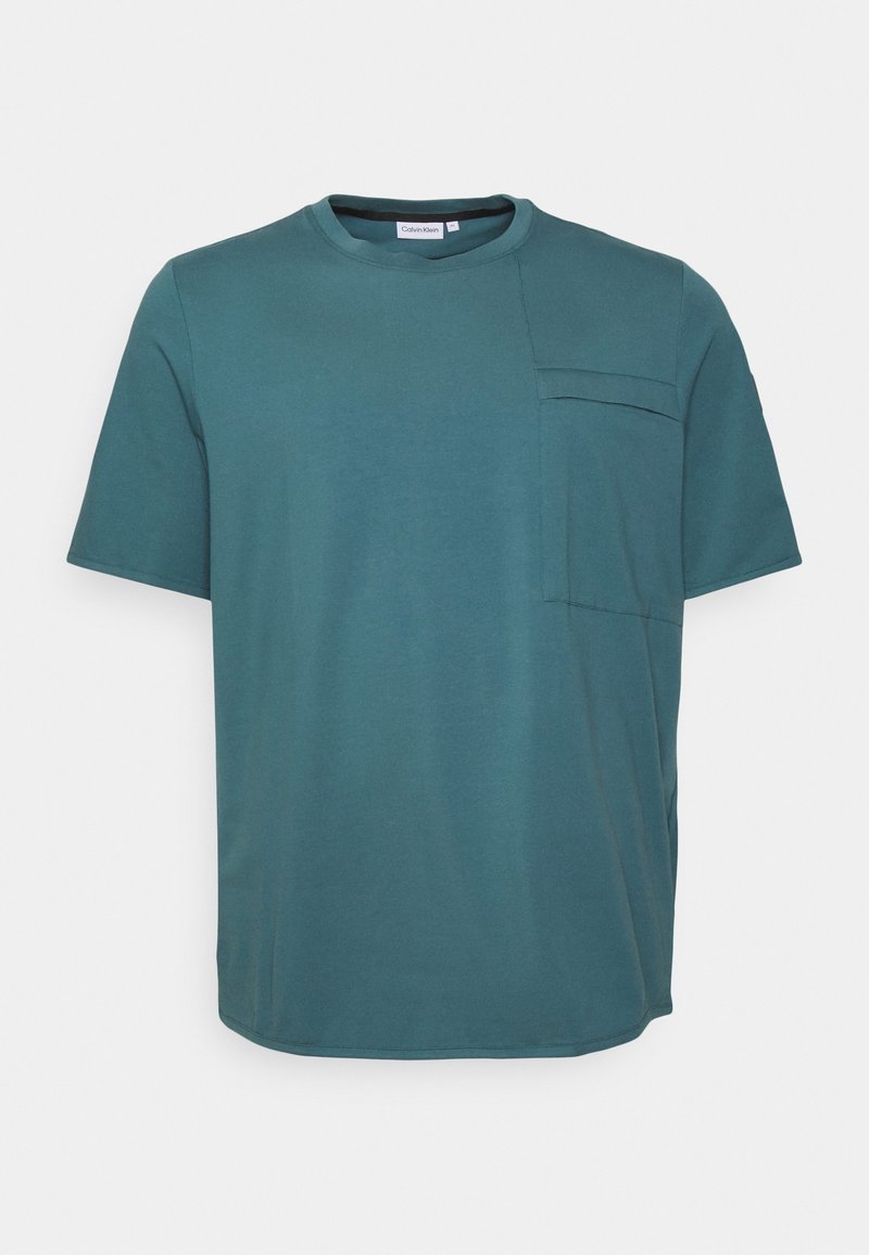 Teal short-sleeve t-shirt made of soft cotton, featuring a rounded neckline and a left chest pocket with a subtle seam detail.