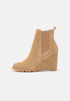 Højhælede støvletter - beige