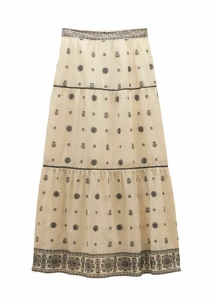 Beige gelaagde rok met zwarte bloemen- en cirkelpatronen, decoratieve tailleband en een brede bloemenzoom aan de onderkant.