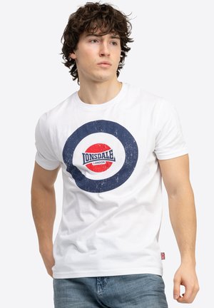 White cotton t-shirt featuring a circular graphic in navy, red, and white with the "Lonsdale London" logo in the center. Short sleeves.