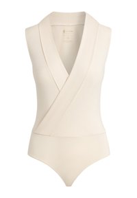 Bodysuit sin mangas en color beige con diseño cruzado, hecho de una tela suave, que presenta un escote en V profundo y una parte inferior ajustada.