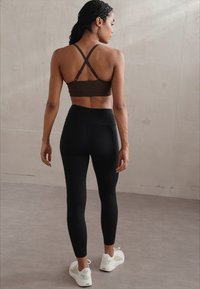 Puma W SHAPELUXE - Leggings - black