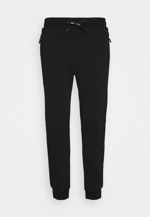 Pantalones de chándal negros con una cintura elástica ajustable, bolsillos laterales con cremallera y puños ajustados en los tobillos. Hechos de una tela suave con una textura lisa.