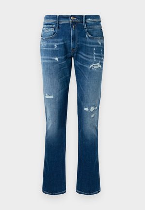 Blå denimjeans med raka ben, slitna detaljer, fransade lappar och klassisk femficksdesign.
