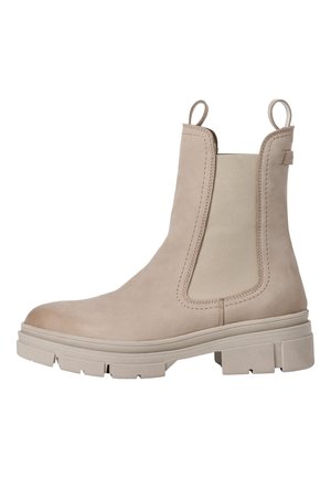 Botte Chelsea en cuir beige avec des panneaux latéraux élastiques, une languette de tirage et une semelle en caoutchouc épaisse. Design épuré et texture lisse.