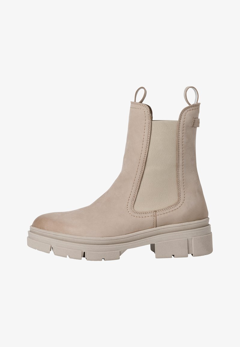Bota Chelsea de piel beige con paneles laterales elásticos, tira de agarre y suela de goma gruesa. Diseño elegante y textura suave.