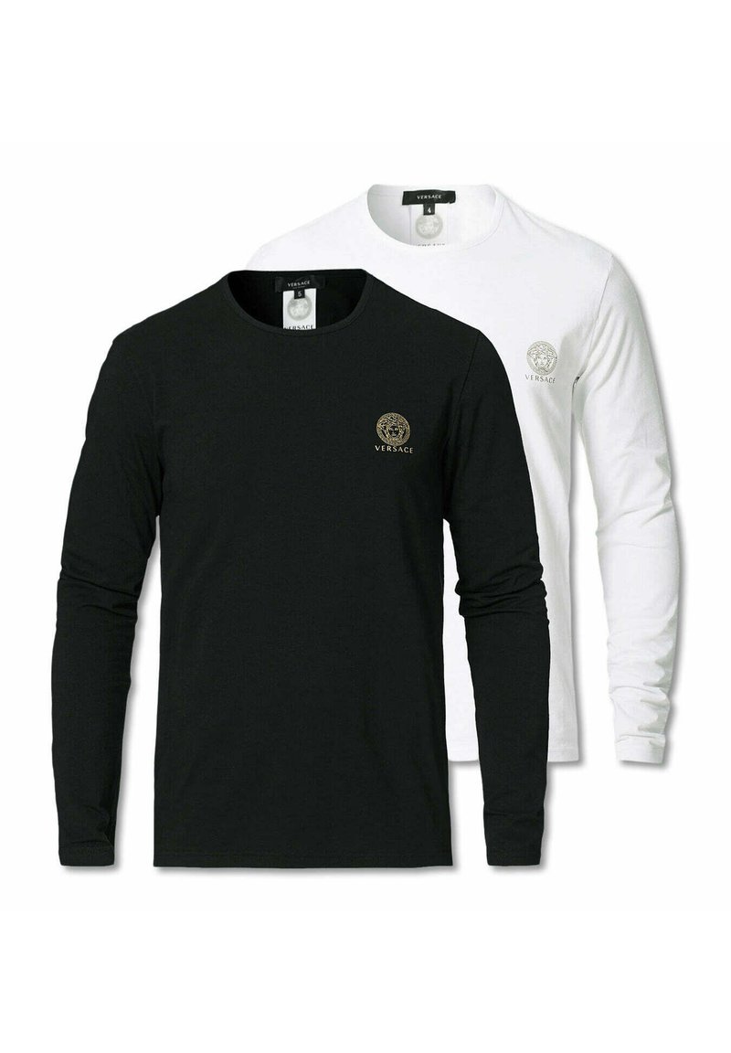 Two long-sleeve t-shirts, one black and one white, featuring a round neck and a logo on the chest, made of smooth fabric.