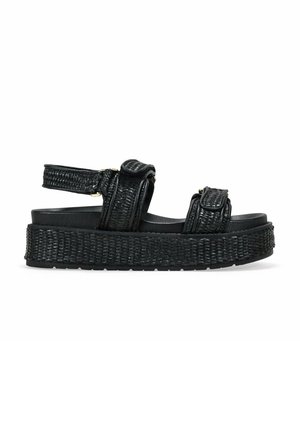 Sandalias de plataforma negras con diseño de tiras trenzadas, correas para el tobillo ajustables, suela texturizada y una suela ancha trenzada para mayor altura.