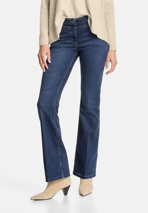 Flared Jeans - dark blue denim mit use
