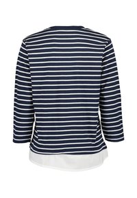 Marineblau-weiß gestreifte langärmlige Bluse mit rundem Halsausschnitt und einem weißen Überhang. Weicher Stoff mit lässiger Passform.