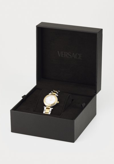 Versace watch with gold and silver stainless steel band, round white face with gold accents, in a black box with a velvet interior.