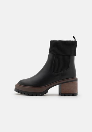 Enkellaarsjes met plateauzool - black