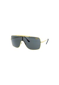 Occhiali da sole con montatura in metallo dorato e grandi lenti grigie, caratterizzati da una barra frontale prominente. Presentano aste slanciate con punte nere e una forma geometrica moderna.