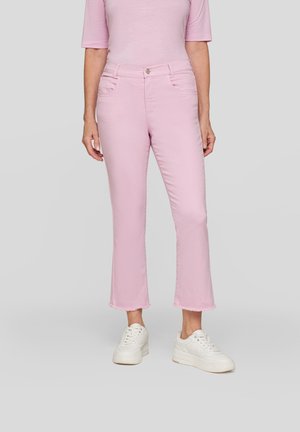 Light pink cropped jeans with a frayed hem, featuring two front pockets and a classic zip-fly closure, paired with white sneakers.
