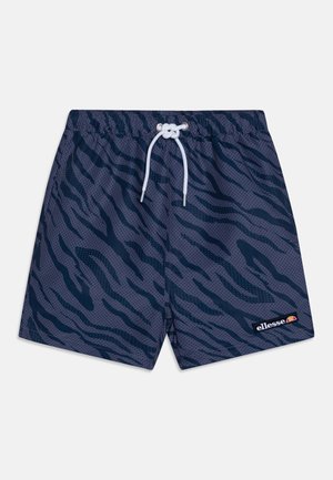 Bañadores de color navy con un patrón de rayas de tigre, que cuentan con una cintura ajustable mediante cordón y una pequeña etiqueta de logo en el dobladillo. Fabricados con material ligero.