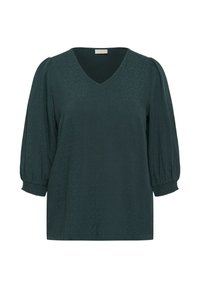 Blouse vert foncé à col en V avec des manches bouffantes trois-quarts et des poignets smockés, présentant un motif texturé subtil.