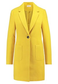 Blazer ajusté jaune avec un col cranté, fermeture à un bouton noir, deux poches avant et une doublure lisse.