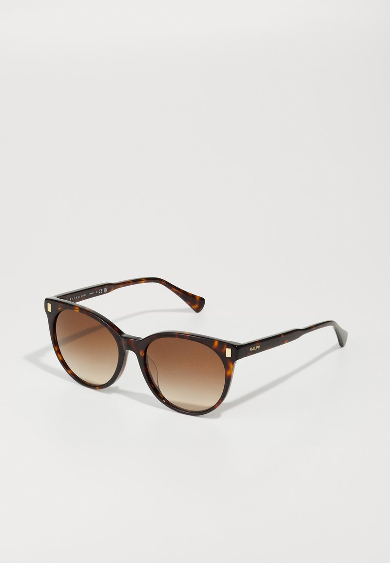 Braune Schildpatt-Sonnenbrille mit übergroßer quadratischer Form. Verlaufene braune Gläser. Goldene Akzente an den Rahmen. Glatte Kunststoffoberfläche.