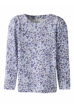 Langermet skjorte med rund hals, dekket av et lite blomstermønster i blått, lilla og grått på hvit bakgrunn.