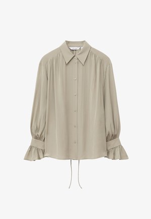 Blouse beige à manches longues avec boutons sur le devant, col pointu, épaules froncées et poignets à volants avec détail de lien coulissant à l'ourlet.