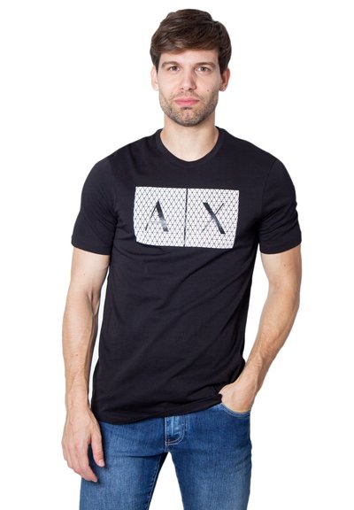 T-shirt noir à manches courtes avec un graphisme géométrique blanc représentant deux lettres stylisées sur le devant. Matière en coton doux.