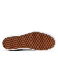 Rubber shoe sole with a diamond-shaped pattern. The edges are white, and the main part is brown with a textured finish.