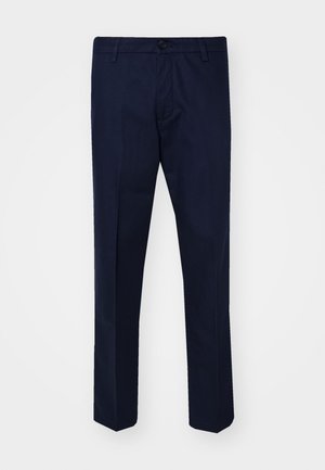 Tmavě modré kalhoty vyrobené z hladké tkaniny, s rovnými nohavicemi, zapínáním na knoflík a předními kapsami.