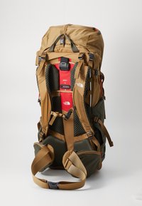Brown and olive green backpack featuring a structured design, cushioned straps, mesh back panel, and multiple adjustment buckles.
