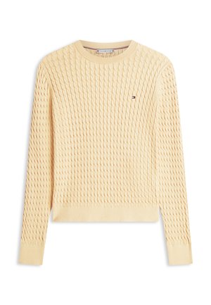 Maglione lavorato a maglia in giallo chiaro con un motivo a trecce testurizzato. Presenta una scollatura rotonda e polsini e orlo a coste. Piccolo logo sul petto.