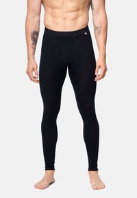 Leggings termici neri realizzati in tessuto elasticizzato, con un design aderente, una vita e una tasca frontale. Texture liscia, lunghezza alla caviglia.
