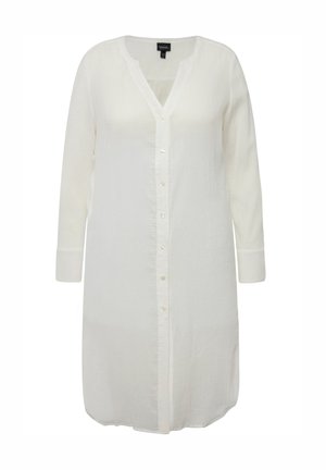 Camicia bianca con bottoni, maniche lunghe, scollo a V e pattina con bottoni. Realizzata in un tessuto leggero e testurizzato. Orlo arrotondato.