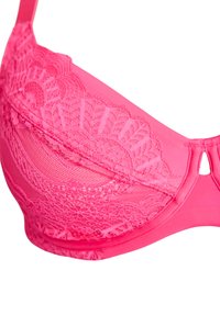 Rozā mežģīņu krūšturis ar smalku ziedu rakstu, ar stīpiņām nodrošinātu atbalstu un daļēji caurspīdīgiem paneļiem, ar gludām malām un regulējamām siksniņām.