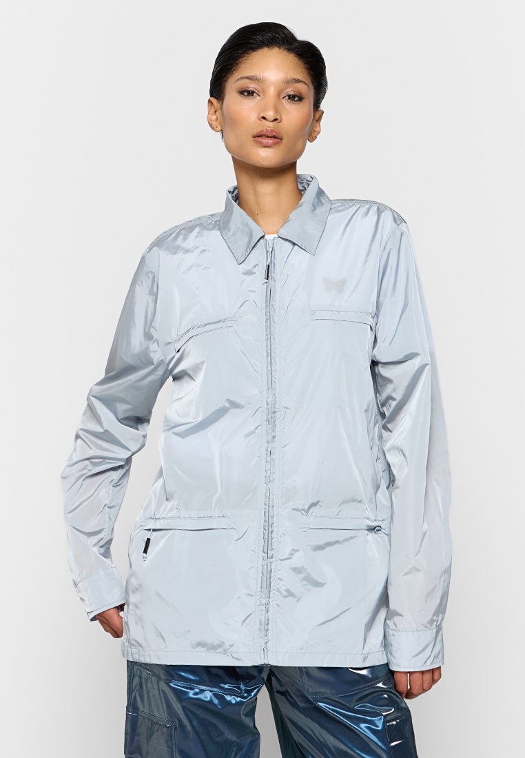 Rains Lichte jas lichtblauw Rains Lichte jas lichtblauw