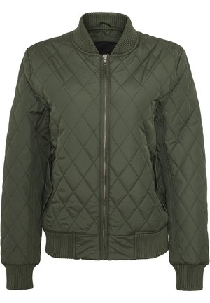 Veste matelassée vert olive avec fermeture éclair devant, col, poignets et bas côtelés, présentée sur fond blanc.