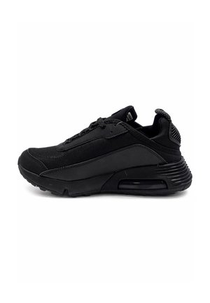 Black low-top athletic sneaker with textured sole, mesh and synthetic upper, lace-up closure, and padded heel pull tab.
