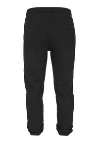 Zwarte joggingbroek met een elastische tailleband, taps toelopende pijpen en een achterzak. Gemaakt van zachte, gestructureerde stof, geschikt voor casual draagplezier.
