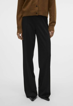 Pantalons noirs taille haute avec une coupe large, fabriqués dans un tissu lisse. Comprend des détails de couture verticaux et un design ajusté.