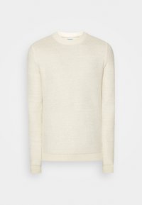 Světlý krémový pletený svetr s kulatým výstřihem, dlouhými rukávy a žebrovanými manžetami a lemem. Celý materiál má texturovaný vzor.