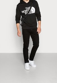 The North Face Jersey con capucha - black