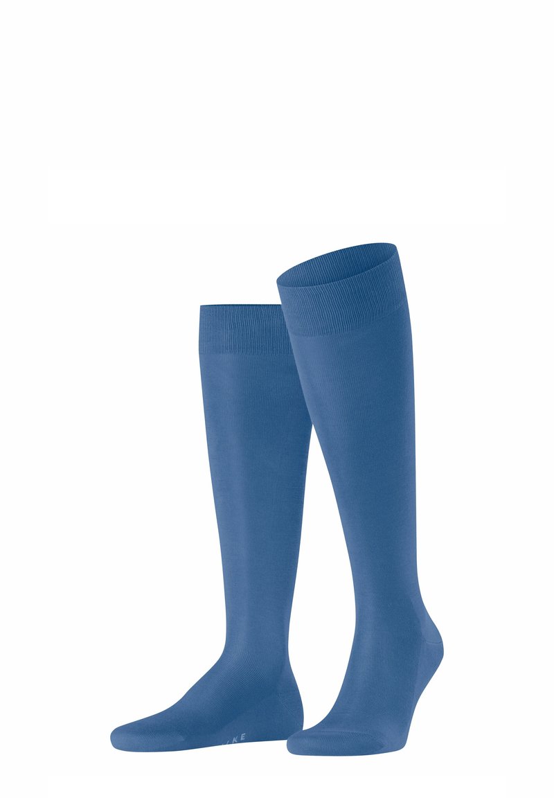 Calze al ginocchio in blu uni con una texture liscia, punta rinforzata e polsino a coste per una vestibilità sicura. Tessuto leggero e elasticizzato.