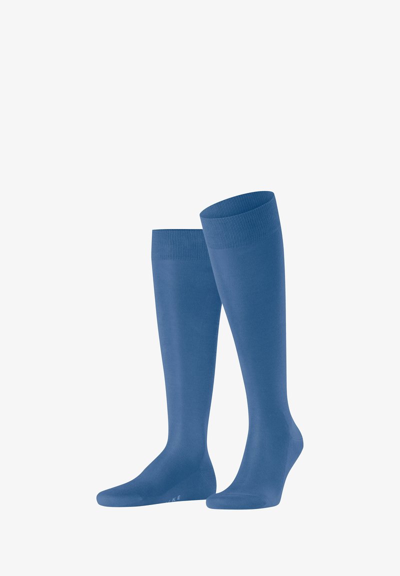 Calze al ginocchio in blu uni con una texture liscia, punta rinforzata e polsino a coste per una vestibilità sicura. Tessuto leggero e elasticizzato.