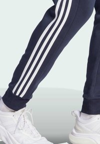 adidas Sportswear ESSENTIALS TAPERED CUFF 3-STRIPES  - Trainingsbroek - legend ink