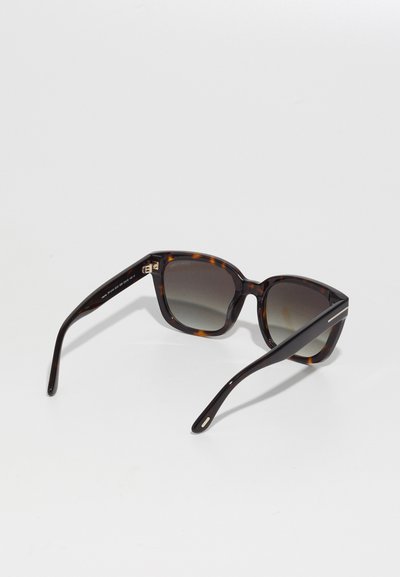 Tortoiseshell sunglasses with a squared design, gradient dark lenses, and silver-tone accents on the arms. Smooth plastic material.