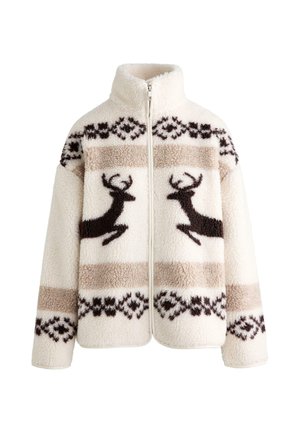 Veste crème duveteuse avec fermeture éclair, ornée de rennes marron et de motifs géométriques sur le devant, confectionnée dans un tissu doux et texturé.