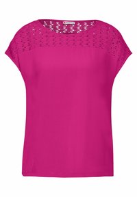 Fuksianpunainen yläosa, jossa on sileä kangas, pitsikuvioitu yläosa ja lyhyet hihat. Yksinkertainen, rento malli pyöreällä pääntiellä.